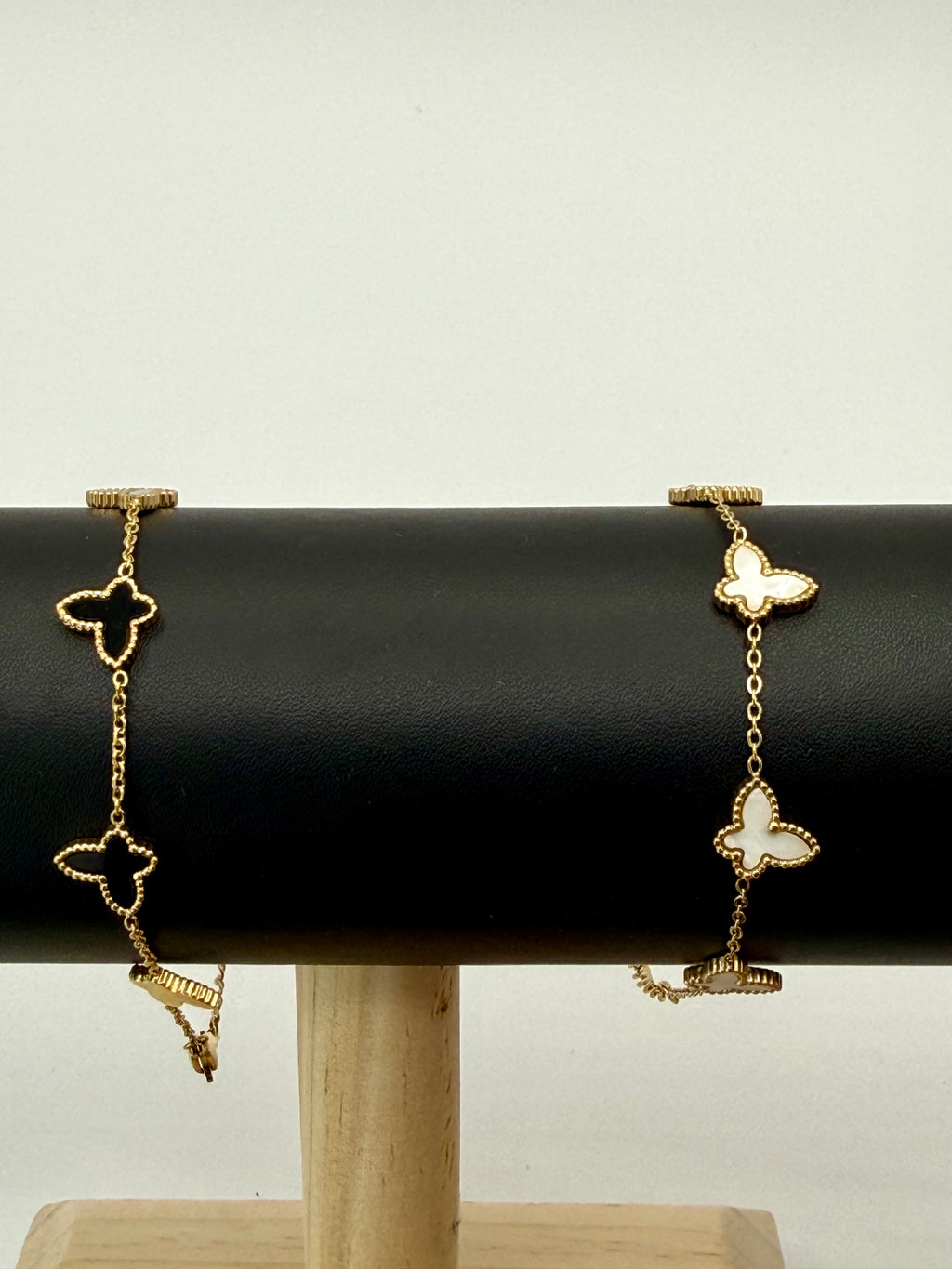 Golden color metal bracelet with white butterflies